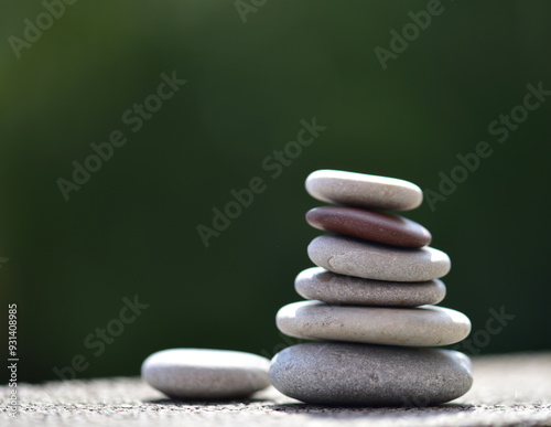 zen stones on green background