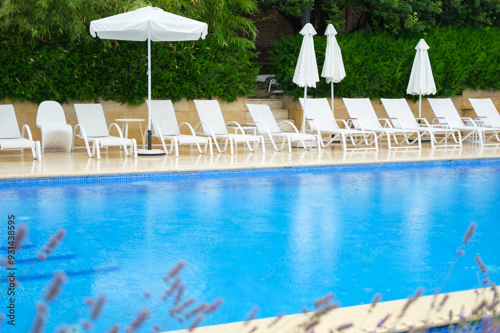 swimming pool and chairs swimming pool and chairs