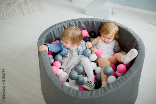 Obraz na plátne children playing with toys in the babble pool