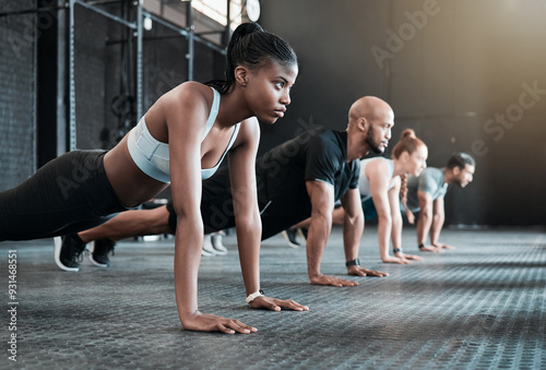 Group, push up and cardio training for fitness, exercise and gym class, club or core workout for challenge. People, personal trainer or friends collaboration for weight loss, endurance and health