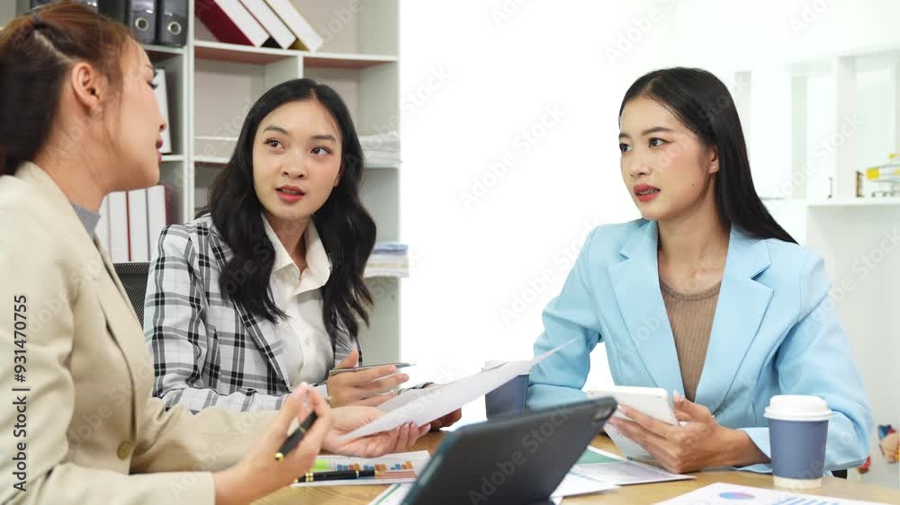 Group of Asian women Work and discuss documents at the office Group of Asian women Work and discuss documents at the office