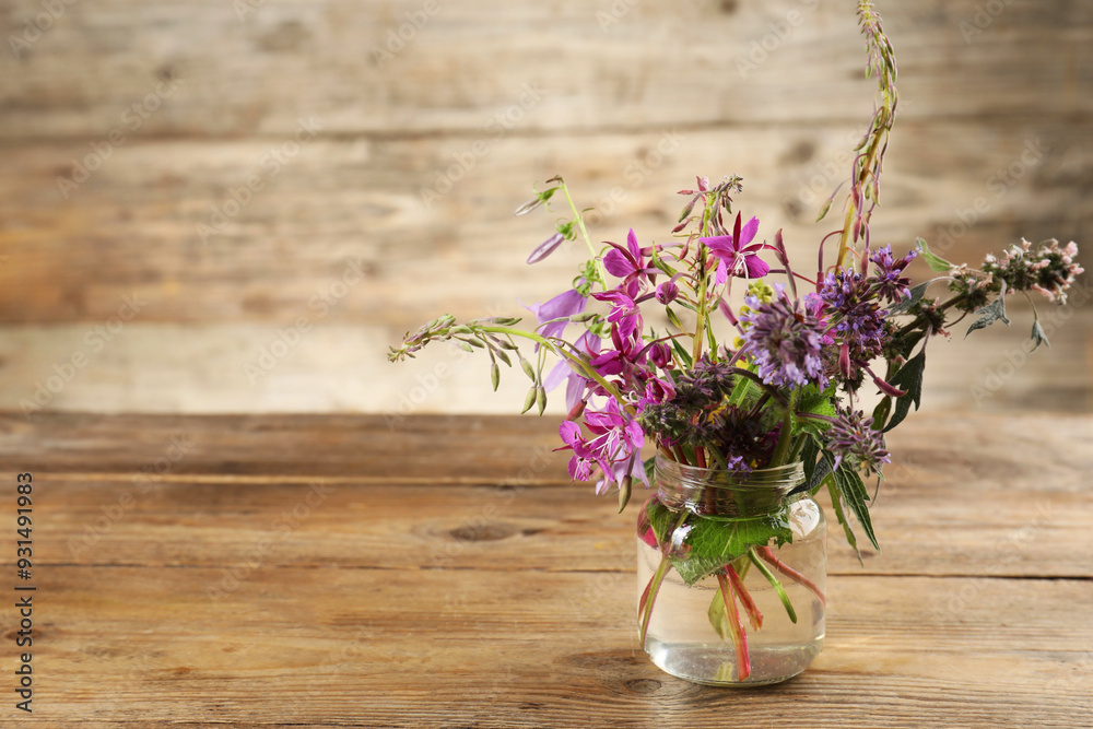 Bouquet of different healing herbs on wooden table. Space for text Bouquet of different healing herbs on wooden table. Space for text