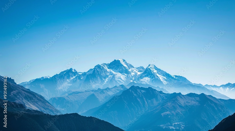 Fototapeta premium Mountains with snow-capped peaks and clear blue skies, a stunning natural landscape