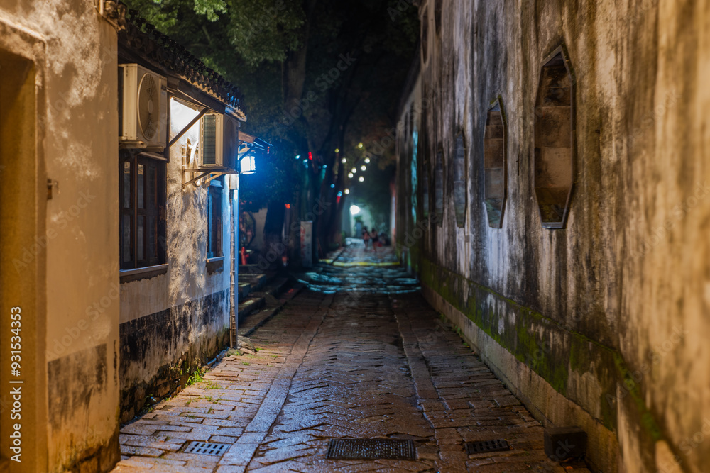 Obraz premium old buildings and neighborhood at night,light design,street shop