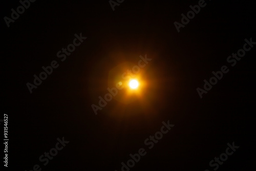 Sun flare on the black background