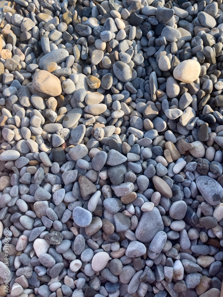 Natural Pebble Stones in a Close-Up Textured Background Natural Pebble Stones in a Close-Up Textured Background