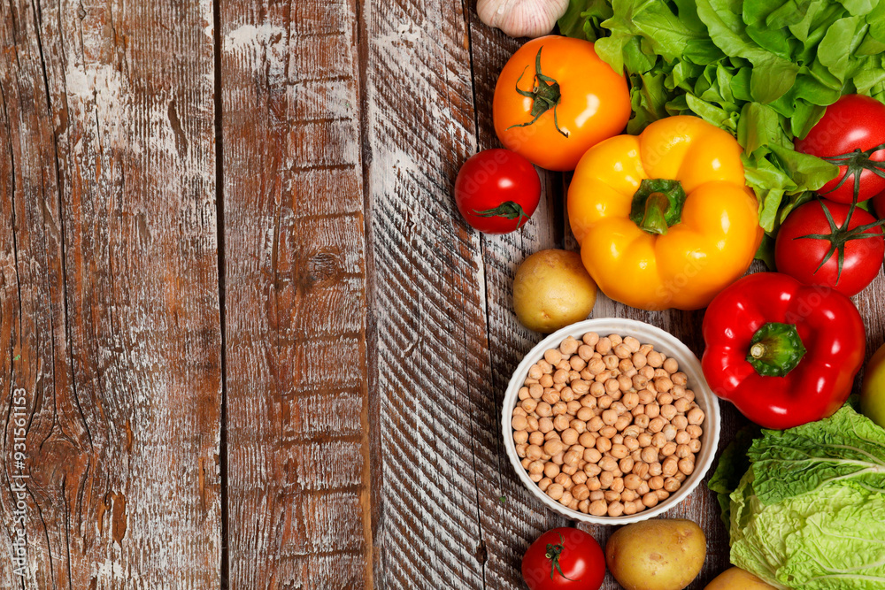 Different vegetarian products on wooden table, top view. Space for text Different vegetarian products on wooden table, top view. Space for text