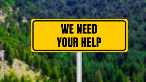 Fotografie We need your help message written on yellow metal sign  on nature background
