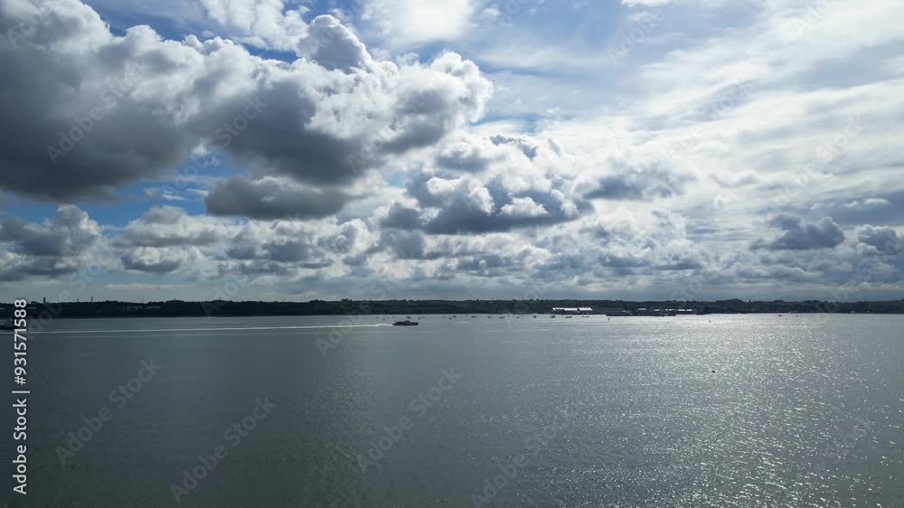 High Angle View of Boat at Netley Beach and Ocean Near Southampton Port City on a Sunny Day over England United Kingdom. May 17th, 2024 High Angle View of Boat at Netley Beach and Ocean Near Southampton Port City on a Sunny Day over England United Kingdom. May 17th, 2024