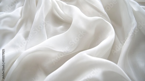 Macro close-up of white fabric with a crumpled texture, highlighting the delicate wrinkles and soft folds with soft focus and diffused lighting for a calm and inviting background.