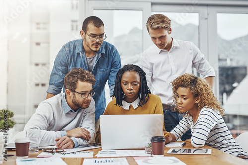 Team, laptop and meeting in office for finance, budget planning and business strategy. Men, women and forecast documents with tech for research analysis, feedback and data for creative startup