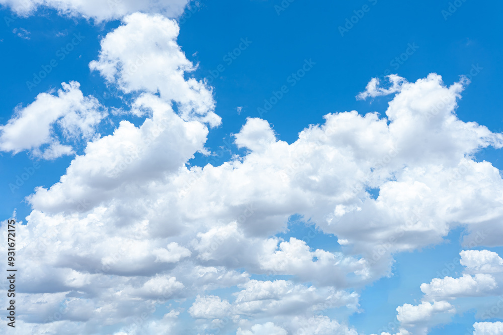 Beautiful blue sky with fluffy white clouds on a clear summer day Beautiful blue sky with fluffy white clouds on a clear summer day