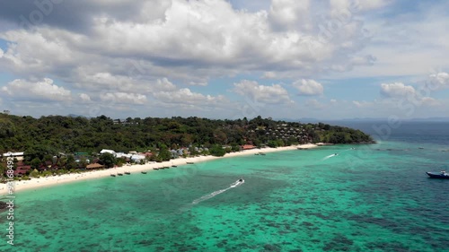Phi Phi beaches, island tour, aerial photography, clear water, coastline. Great place for snorkeling, many corals, turquoise water, fast boat, beautiful islands of Thailand. High quality 4k footage