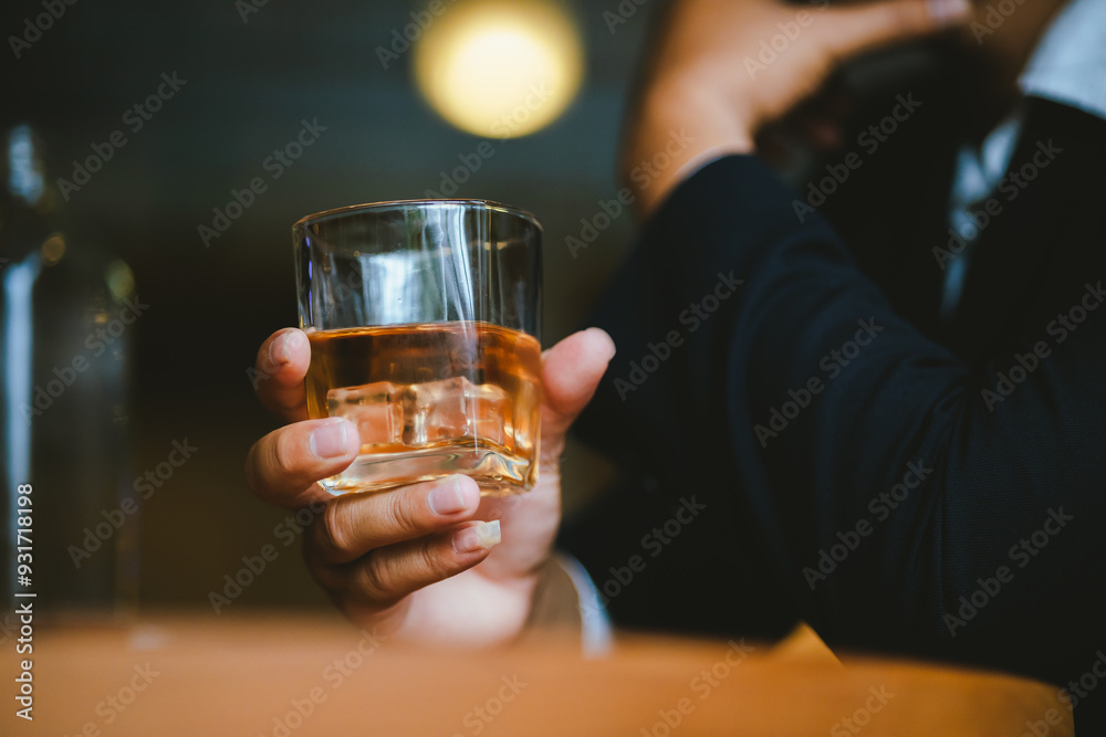 Whiskey drinks at the bar celebrating a special event in a luxury bar. Close-up shows a cheerful atmosphere as glasses clink together, reflecting a lively and joyful gathering. Whiskey drinks at the bar celebrating a special event in a luxury bar. Close-up shows a cheerful atmosphere as glasses clink together, reflecting a lively and joyful gathering.