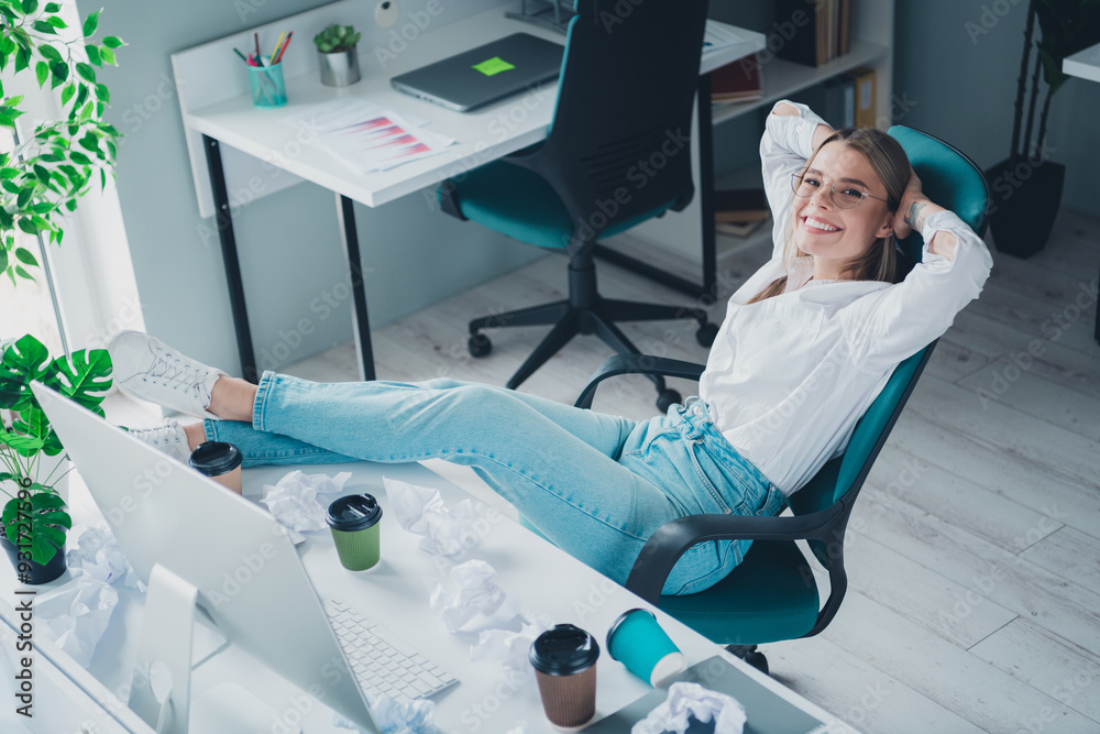 Fototapeta premium Portrait of professional corporate worker lady sitting rest chair modern office indoors