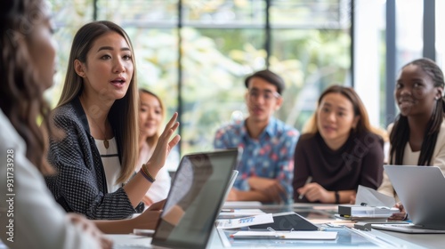 Diverse Business Team Engaged in Serious Discussion During Office Meeting 