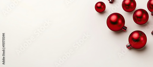 Christmas holiday arrangement featuring red balls on a white background with copy space for your text