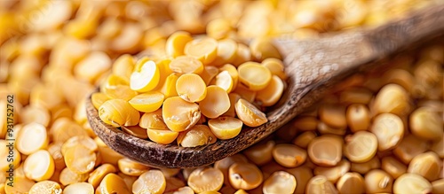 Yellow split peas in a spoo...