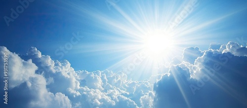 Fototapeta Naklejka Na Ścianę i Meble -  The lovely cloudy sky with sunlight shining through The gentle clouds evoke a sense of relaxation Copy space