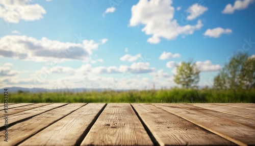 A serene landscape view from a wooden deck, with a vibrant sky and green field in the background, perfect for nature-themed projects.