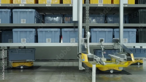 Demonstration of Automated Retail Warehouse AGV Robots Delivering distribution product stock on shelf in modern factory. Smart warehouse Logistics management system with warehouse robot. AI Technology