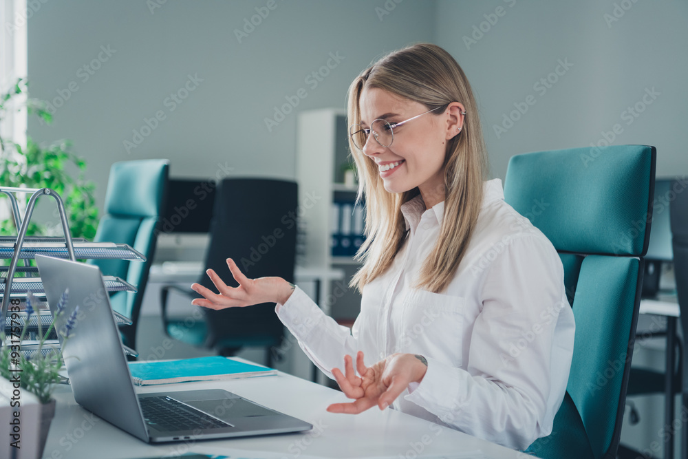 Photo of nice elegant young woman video call laptop wear shirt modern office building indoors Photo of nice elegant young woman video call laptop wear shirt modern office building indoors