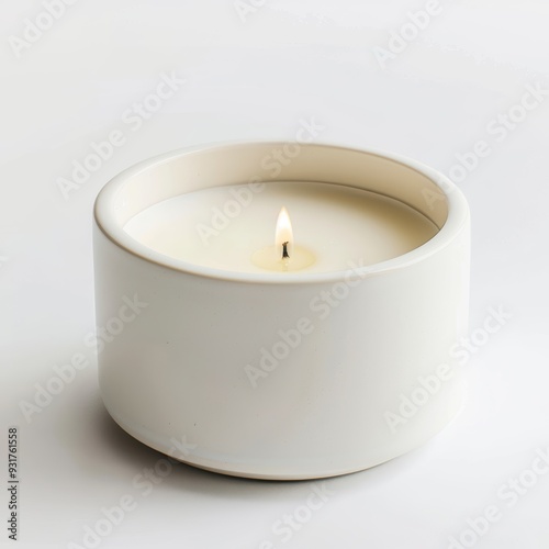 White Ceramic Candle: A simple, elegant white ceramic candle burns brightly against a white background. The soft, warm glow invites relaxation and tranquility. 