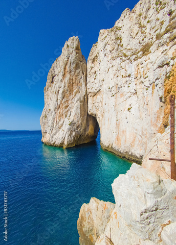 Sardegna, Italy - 20 July 2024 - The worderful south coast of Sardinia region, in the area of Sulcis, province of Cagliari. Here in particular the Pan di Zucchero little rock island and sea