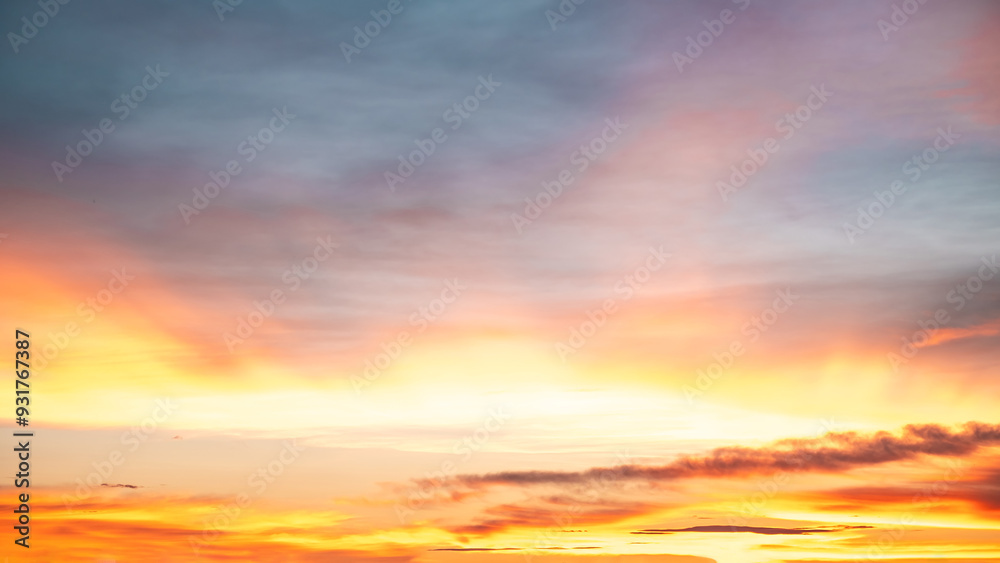 Fototapeta premium Beautiful , luxury soft gradient orange gold clouds and sunlight on the blue sky perfect for the background, take in everning,Twilight, Large size, high definition landscape photo