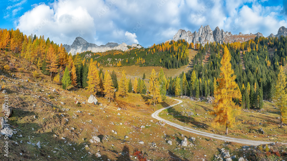 Amazing view of mountains and valleys with larch forest and wonderful sky are located in Filzmoos Amazing view of mountains and valleys with larch forest and wonderful sky are located in Filzmoos