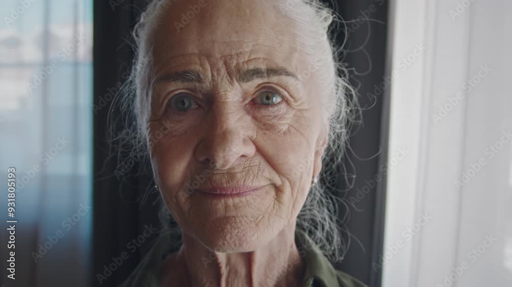 Extreme close-up face portrait of joyous elderly Caucasian woman with ...