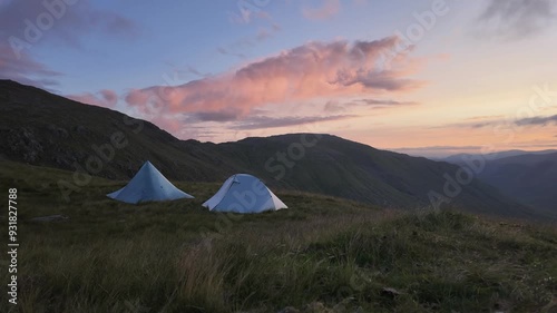 Motionlapse timelapse of 2 tents camping in the mountains at sunrise
