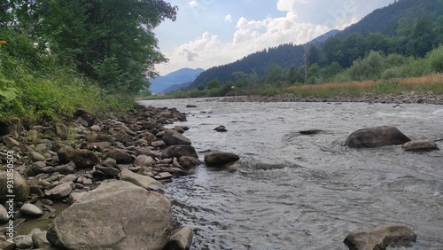 mountain river with stones and fast current
