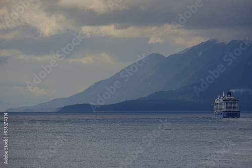 Luxury modern cruiseship cruise ship ocean liner Solstice in Alaska Inside Passage with Glacier mountains, archipelago and lush forest scenic landscape nature view