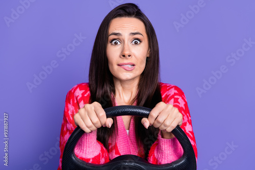 Photo of afraid scared girl wear pink cardigan riding auto biting lip isolated purple color background