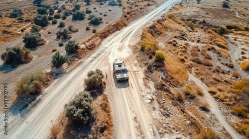 Military Vehicle Driving on a Desert Road