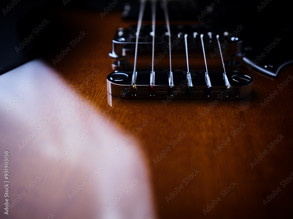 Close up of modern electric guitar on black background. Soft focus. Close up of modern electric guitar on black background. Soft focus.