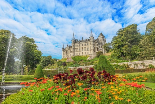 Panoramic picture of Dunrobin Castle and its garden in Scotland during the day