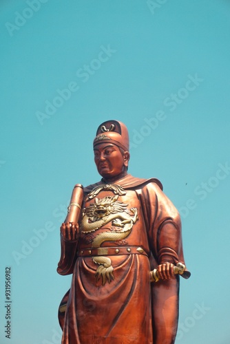 Statue of Admiral Cheng Ho (Zheng He) at Sam Poo Kong Temple, Semarang on a blue sky isolated photo