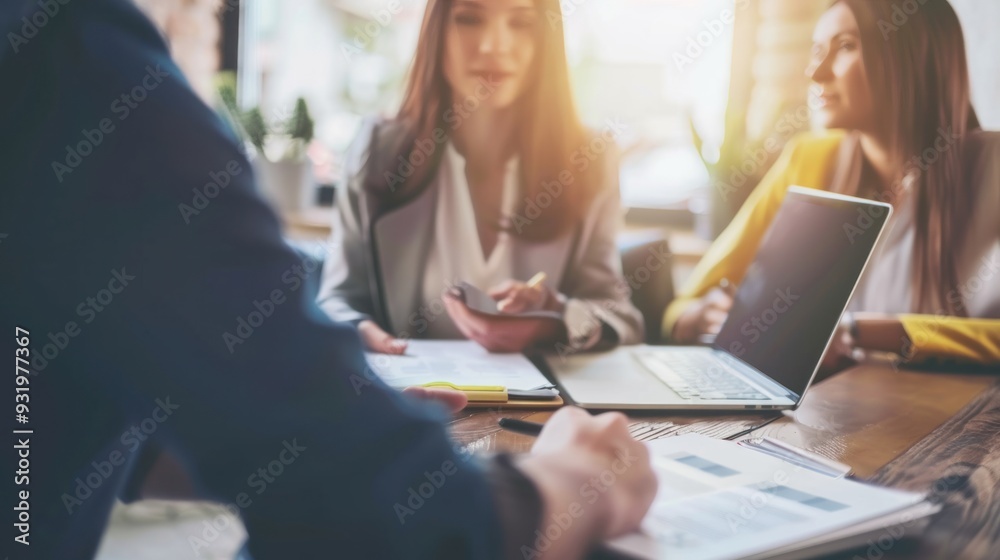A group of business women and men discuss investment and insurance development in a meeting room of the office. A group of business women and men discuss investment and insurance development in a meeting room of the office.