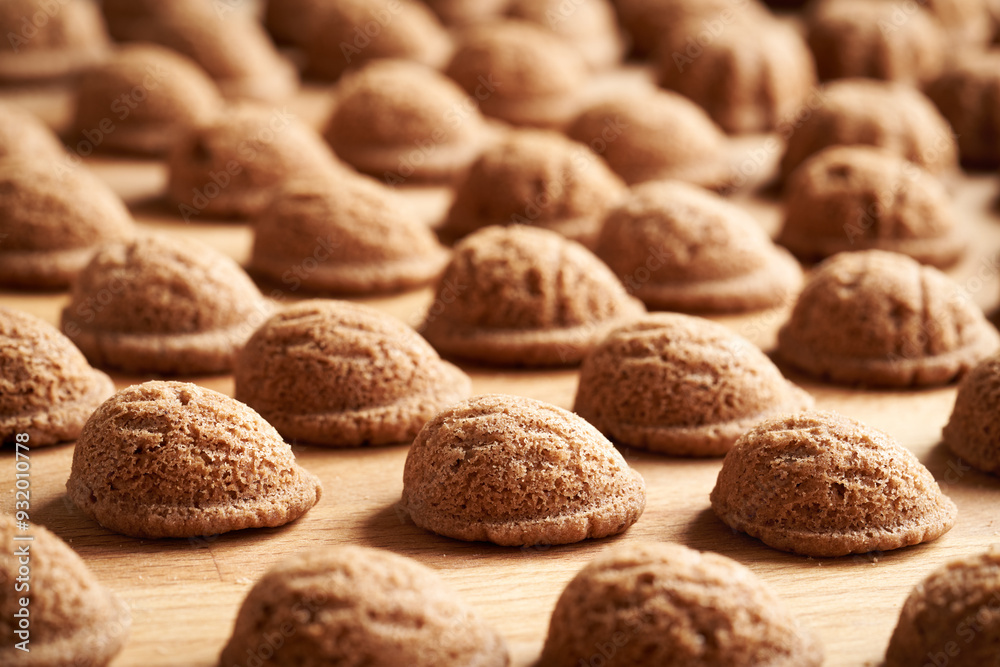 Baked homemade Christmas cookies in the form of nuts on a wooden table Baked homemade Christmas cookies in the form of nuts on a wooden table