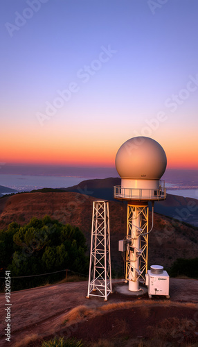 Sunset view of weather station (the Bay Area NEXRAD weather radar) close to the top of Mt Umunhum, San Jose, Santa Cruz mountains, south San Francisco bay area, California isolated with white highli photo