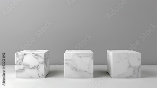 Three White Marble Cubes on a White Surface