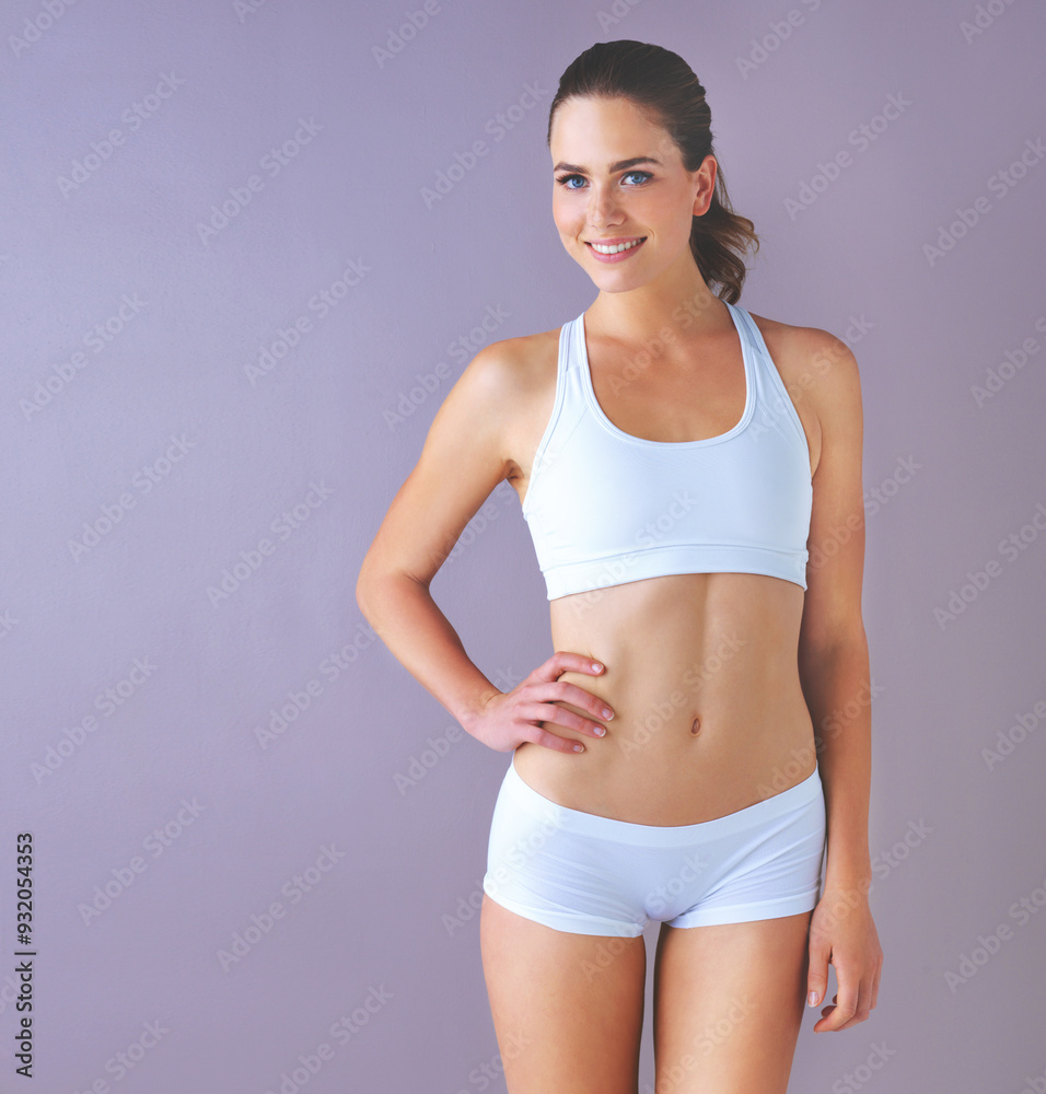 Studio, confidence and portrait of woman with underwear for healthy body, progress or weight loss. Stomach, slim and female person with pride for detox results, diet or self care on purple background Studio, confidence and portrait of woman with underwear for healthy body, progress or weight loss. Stomach, slim and female person with pride for detox results, diet or self care on purple background