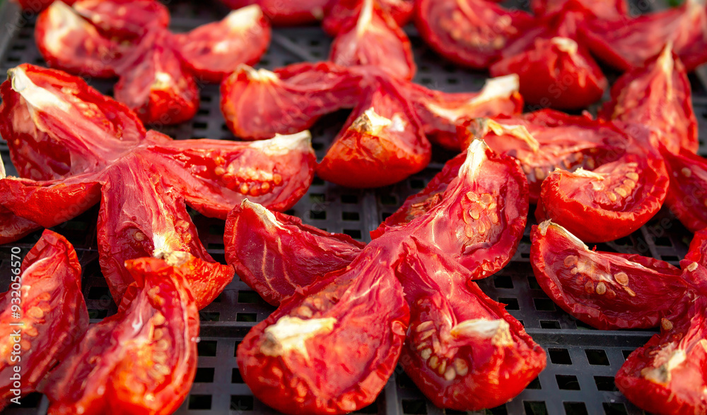 The process of drying tomatoes outdoors for seasoning, for cooking for cooking various dishes The process of drying tomatoes outdoors for seasoning, for cooking for cooking various dishes