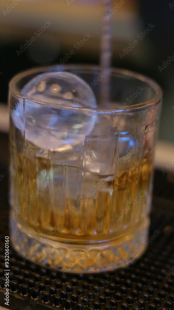 This video showcases the art of whiskey pouring in a bar setting
