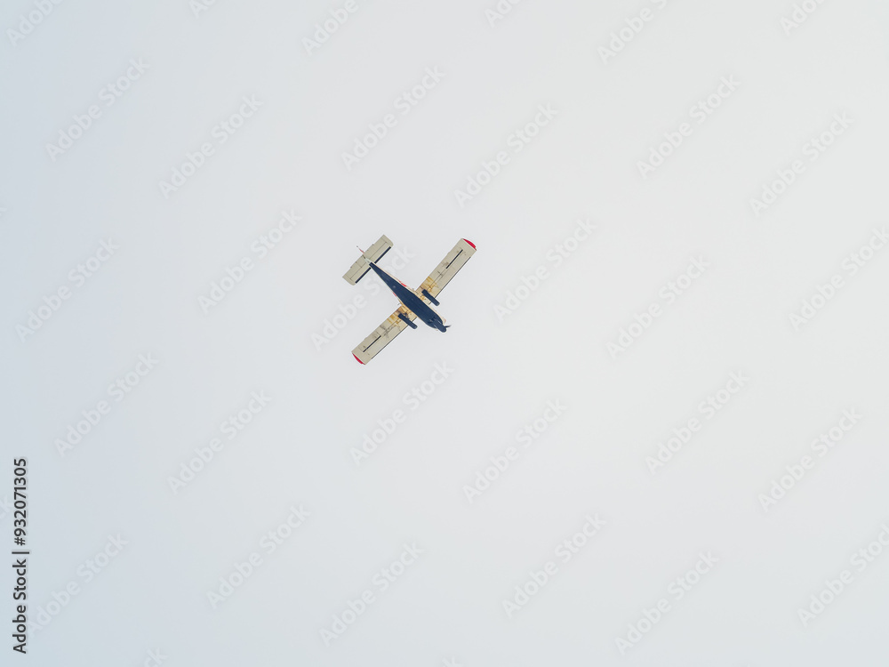 Small ultralight airplane with overhead wing and single propeller flying in sunset sky. Small ultralight airplane with overhead wing and single propeller flying in sunset sky.