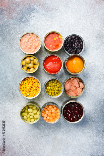 Set of canned preserves food in tin open cans. Food stocks. Side view.