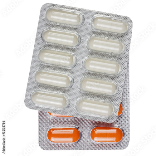 a blister pack of white pills lying on a pack of red pills