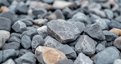 Collection of smooth river stones in various shades on a natural surface